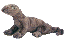 [ID: A Beanie Baby named Scaly. It's a lizard with multi-colored scales, appearing brown from a distance. End ID]